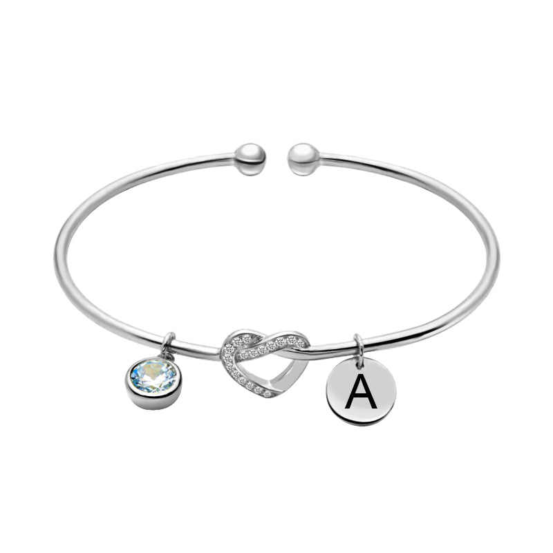 Bracciale a forma di cuore inciso con pietra portafortuna in argento 